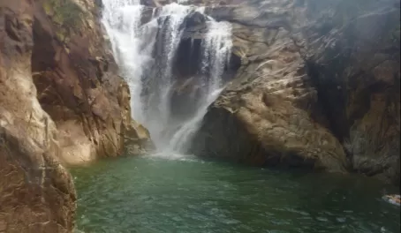 Swimming under the waterfalls at Big Rock