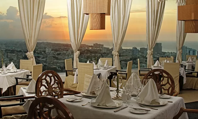 Enjoy the stunning views of the Havana City in the Habana Libre Hotel Retaurant