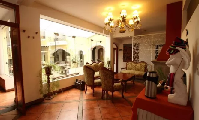 Relax in the cozy sitting room of the Hotel Hacienda Puno