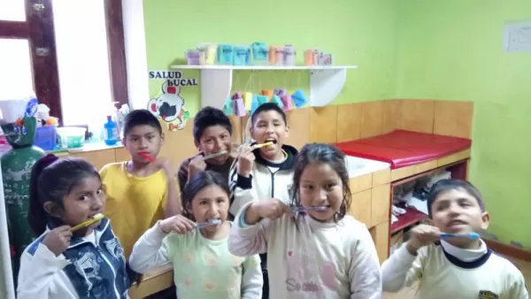 Mantay kids brushing their teeth
