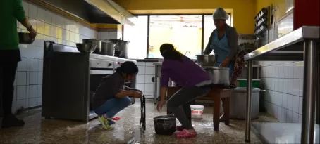 Mantay women washing the kitchen from top to bottom