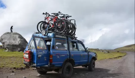 People preparing to mountain bike in Cotopaxi National Park.