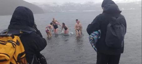 A few brave shipmates plunge into the water