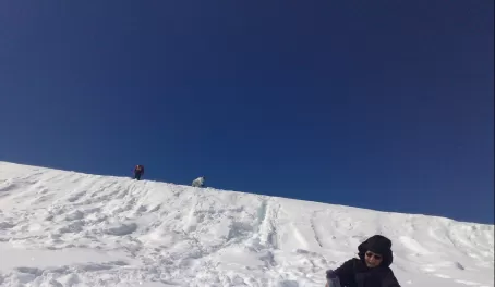 Sliding down the snow and losing a boot