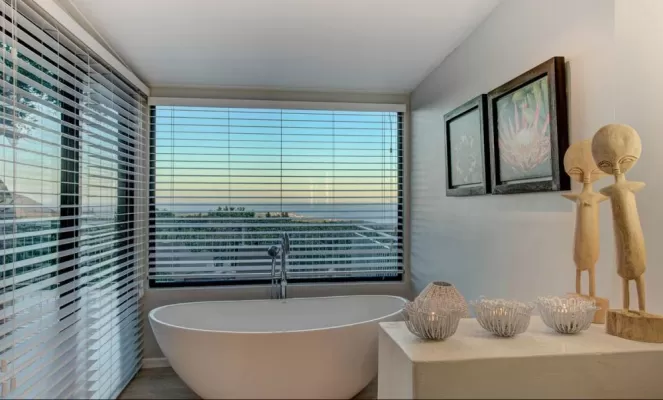 Stylish bathrooms with stunning views at Garden Lodge