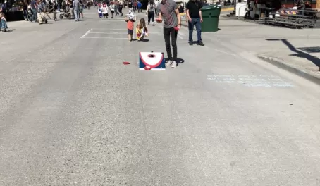 Playing cornhole in the streets of Petersburg. The town closes down for the "Little Norway Days" festival
