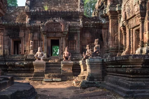Statues and intricate relief carvings inside Angkor Wat