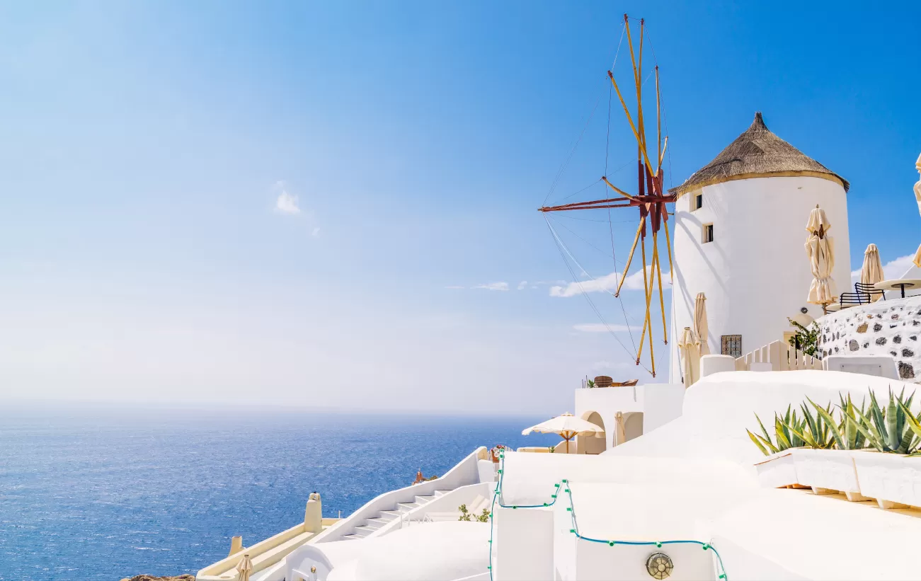 Admire the iconic whitewashed architecture of Santorini