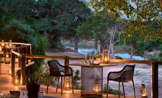 Enjoy a relaxing evening while on the lookout for wildlife at Lion Sands Ivory Lodge