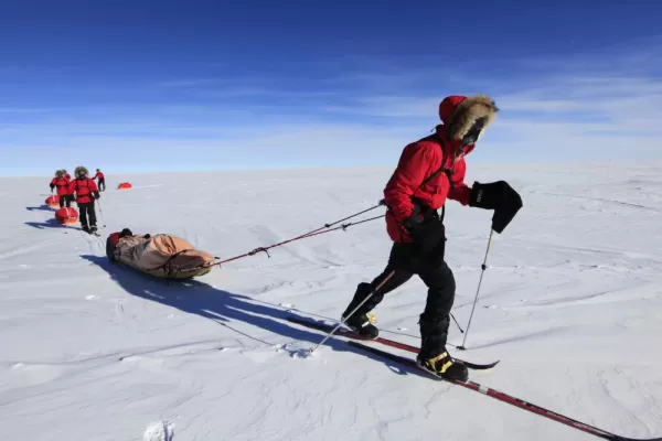 Skier pulling their sled across the polar plateau. Courtesy John Beatty, Antarctic Logistics & Expeditions