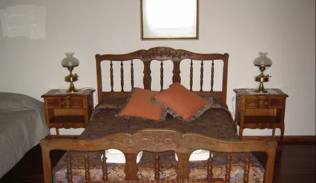 Another room, with the antique bed