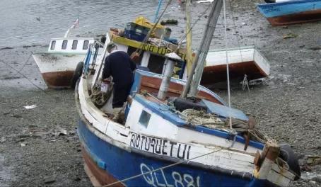 A fisherman preps his boat