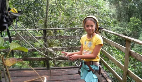 Hanging out on the platform after a rainforest zip line adventure!