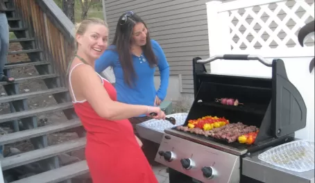 Julia and Renee tend the grill