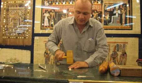 A man doing a demonstration of how to make papyrus