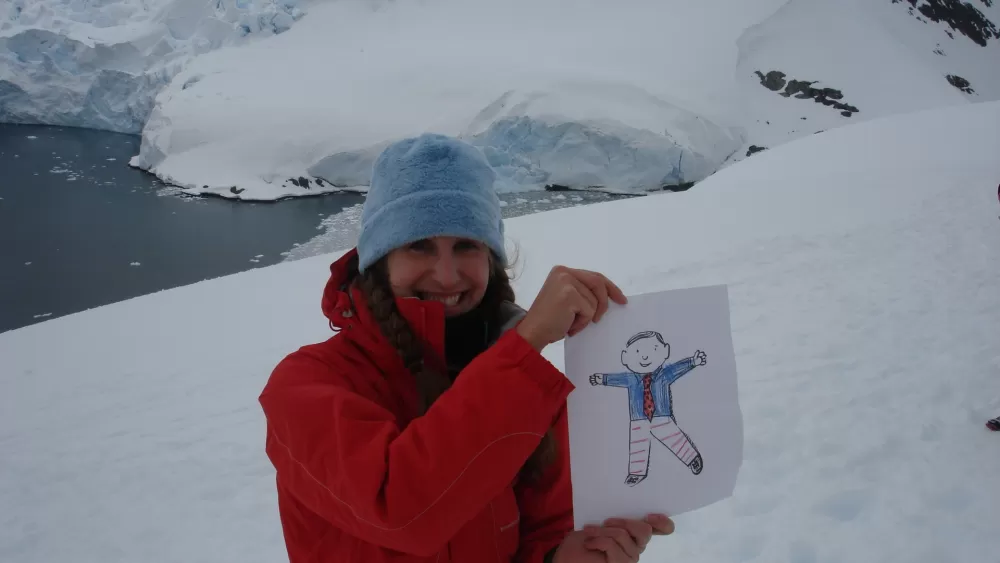 Beth and Flat Stanley at Paradise Bay in Antarctica