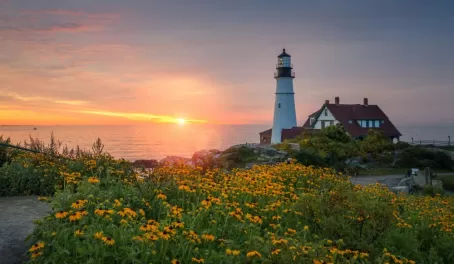 Colorful sunrise at Portland Head Lighthouse in Maine