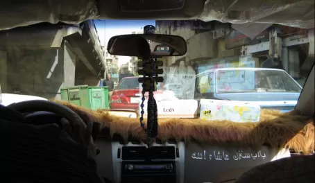 typical taxi in Cairo - note the Quran on the dash