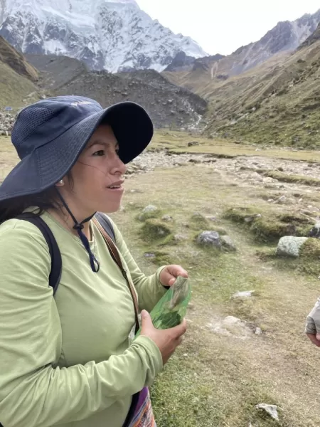 Carla pulling out coca leaves for the toughest part of our hike.