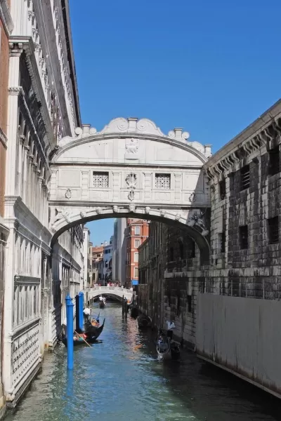 Take a gondola down the canals of Venice, Italy