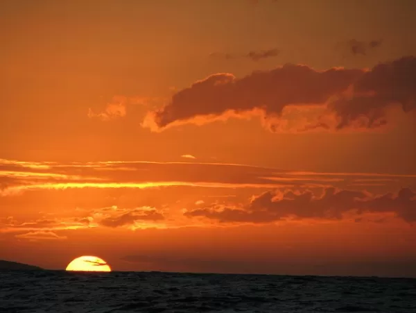 Watch the sun set on your Hawaiian luxury cruise