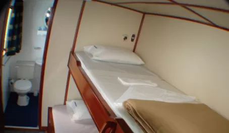 Standard cabins with upper and lower berths, all with private bath facilities
