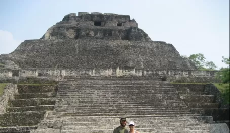 A couple prepares to climb El Castillo at Xunantunich Ruins