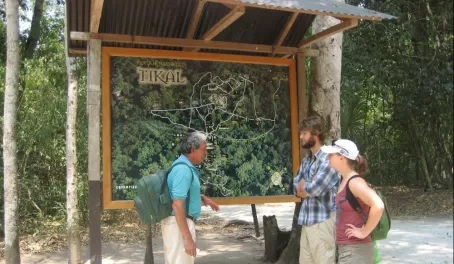 A guide briefs his guests before beginning their tour of the Tikal ruins