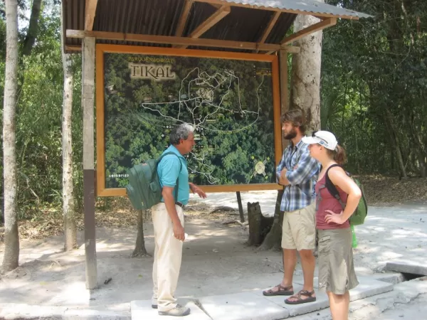 A guide briefs his guests before beginning their tour of the Tikal ruins