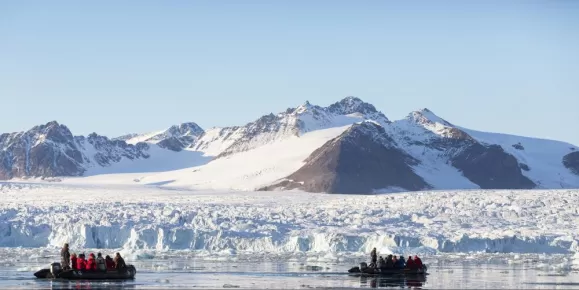 Zodiac cruising near a Greenlandic glacier
