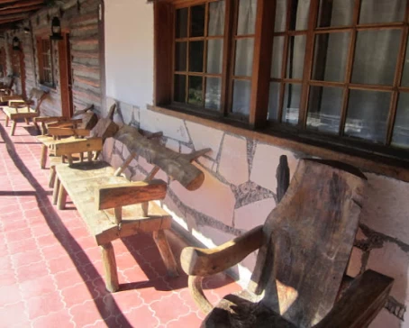 Relax on the porch in hand-crafted log chairs