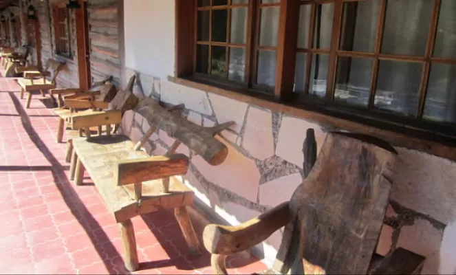Relax on the porch in hand-crafted log chairs