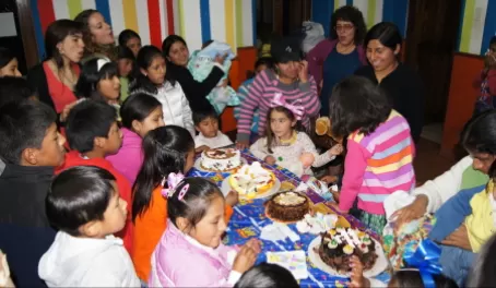 Mothers, Children, & Staff celebrate at the Mantay Shelter
