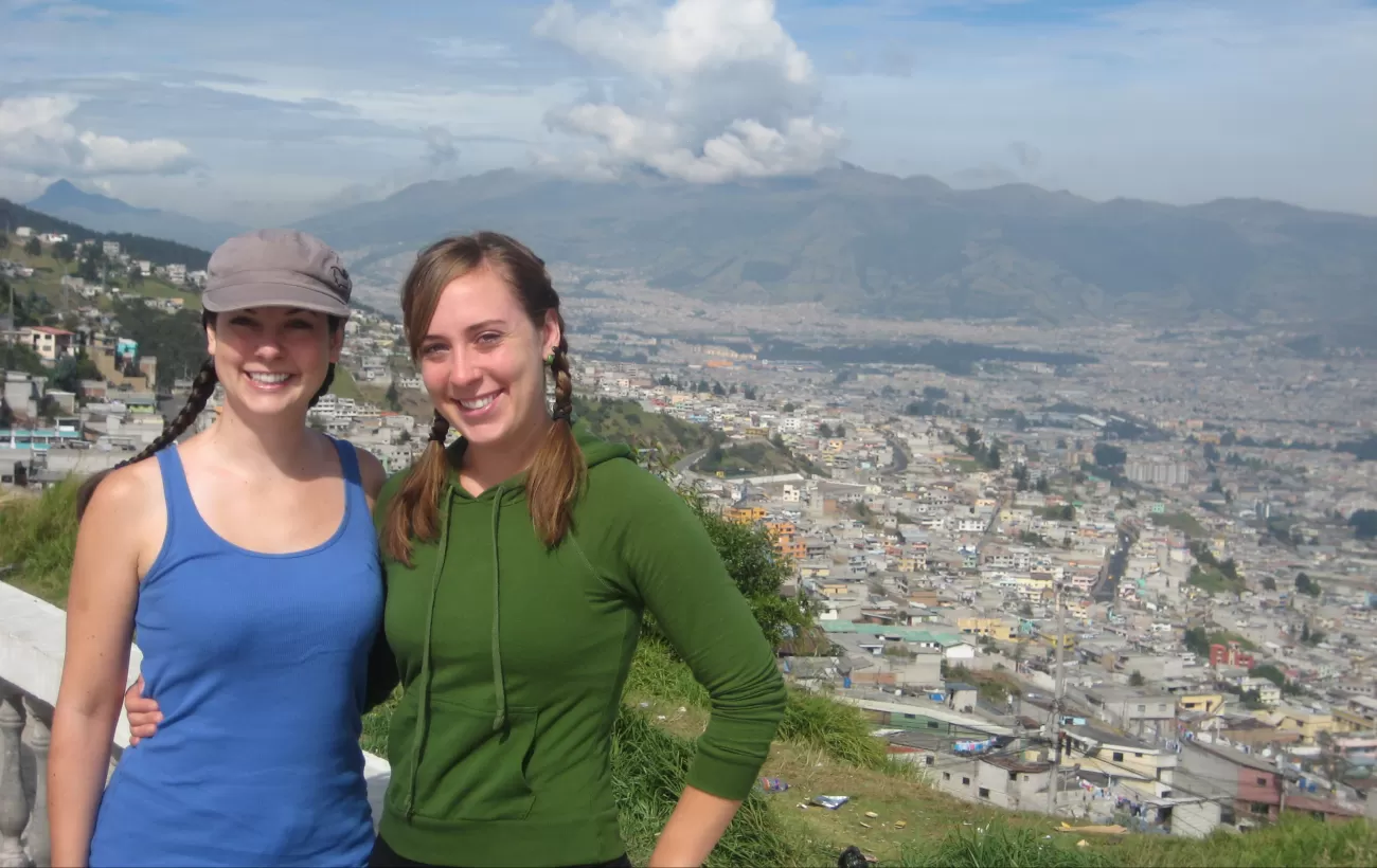 Travelers overlooking the city of Quito, Ecuador