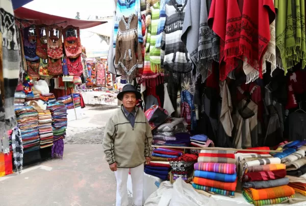 A local selling his weavings in the market