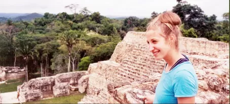 Beth at the top of a Maya ruin at Belizes Caracol