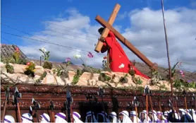 Scenes of the Guatemala Easter Festival, robed curcurances carry floats through Antigua