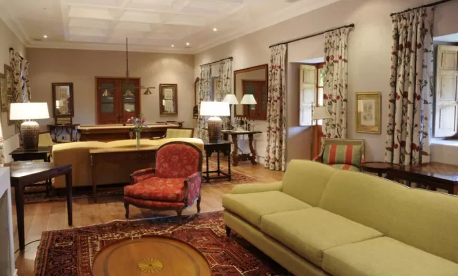 Guests will enjoy lingering in the cozy reading living room with its pool table, chimney and honesty bar