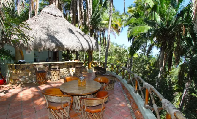 Relax on the deck of your jungle Palapa