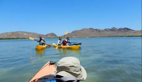 A family sea kayaking in Baja