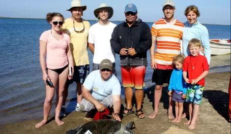 A family participates in sea turtle research in Magdalena Bay