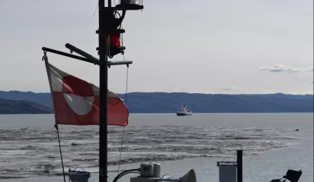 Greenland flag with Sea Adventurer in background