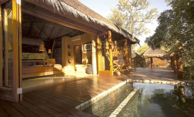 Relax by the pool at Simbambili Lodge
