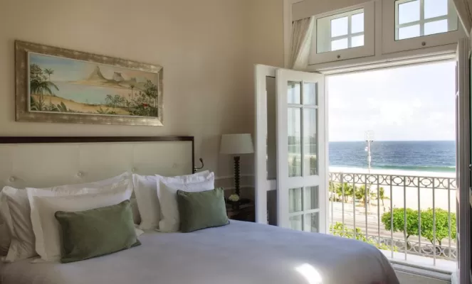 Your private balcony at the Copacabana Palace opens to the beach