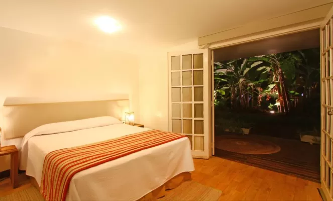 Your suite at Pousada Mar Atlantico is spacious and opens to the outdoors