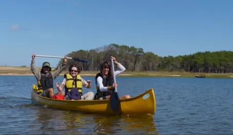 Suzy enjoys the canoe ride across Laguna Rocha in Uruguay