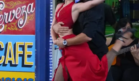 A couple dancing the tango in the streets of La Boca