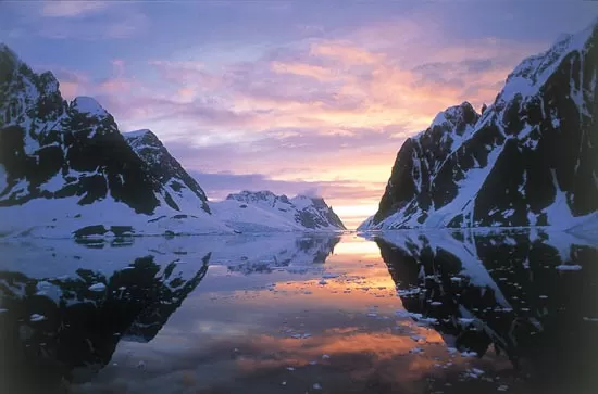 Enjoy a spectacular sunset on the Lemaire Channel during your Antarctica expedition cruise