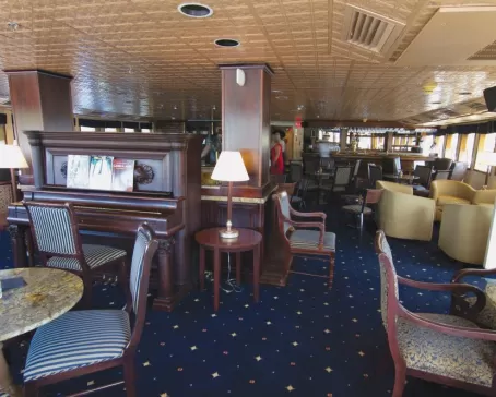 Relax in the Grand Salon aboard the SS Legacy.