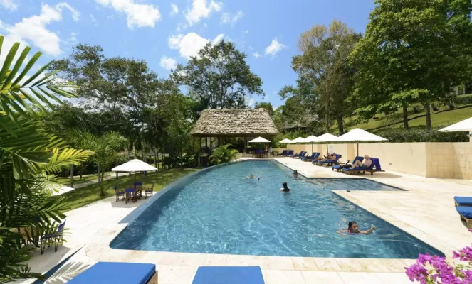 Relax in the pool at the Lodge at Chaa Creek